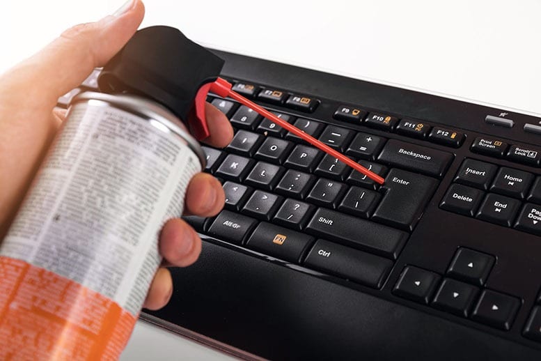 how to clean a computer keyboard with compressed air
